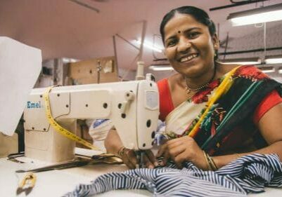 Woman sewing - Creative Handicrafts Coop